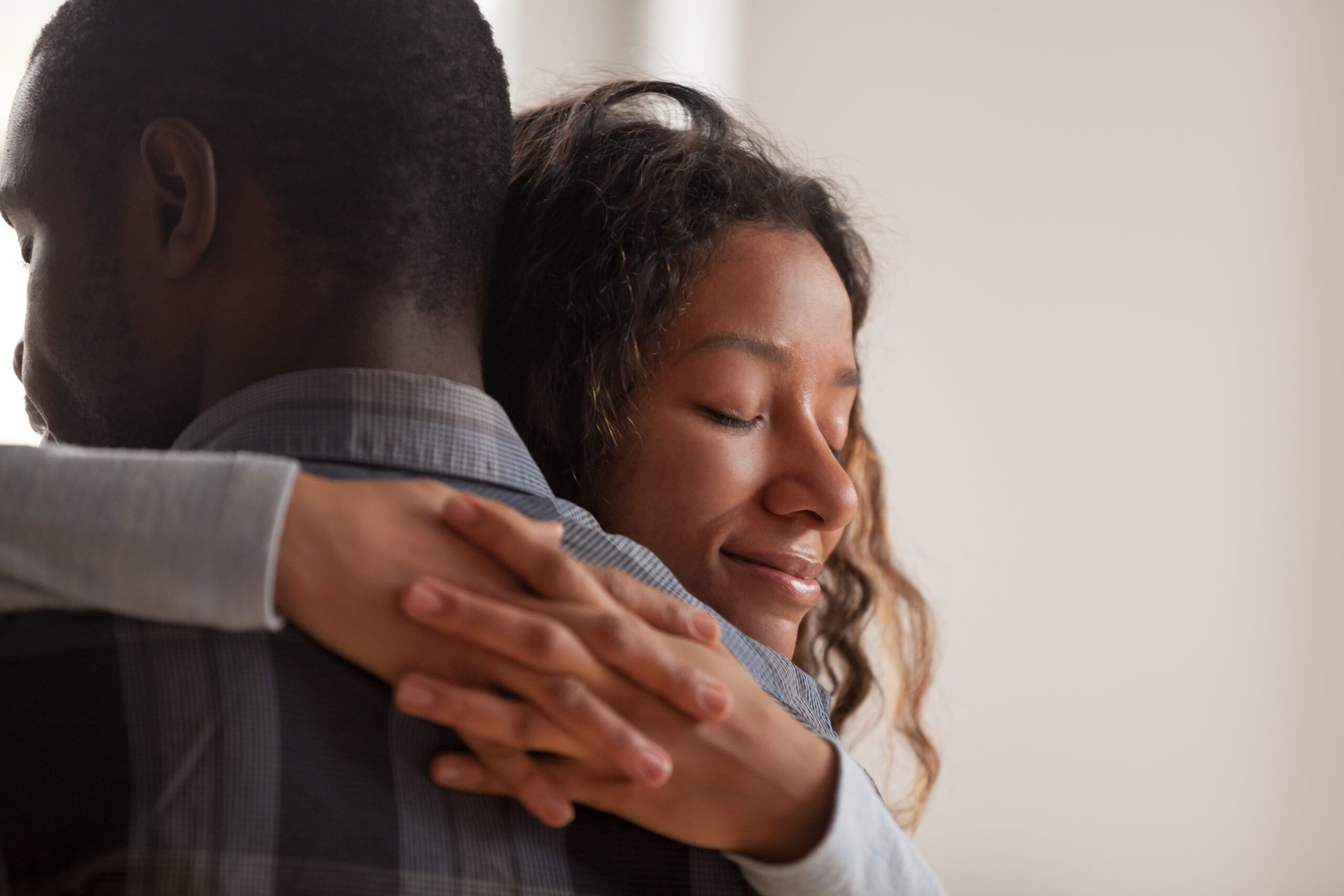 Couple hugging each other.