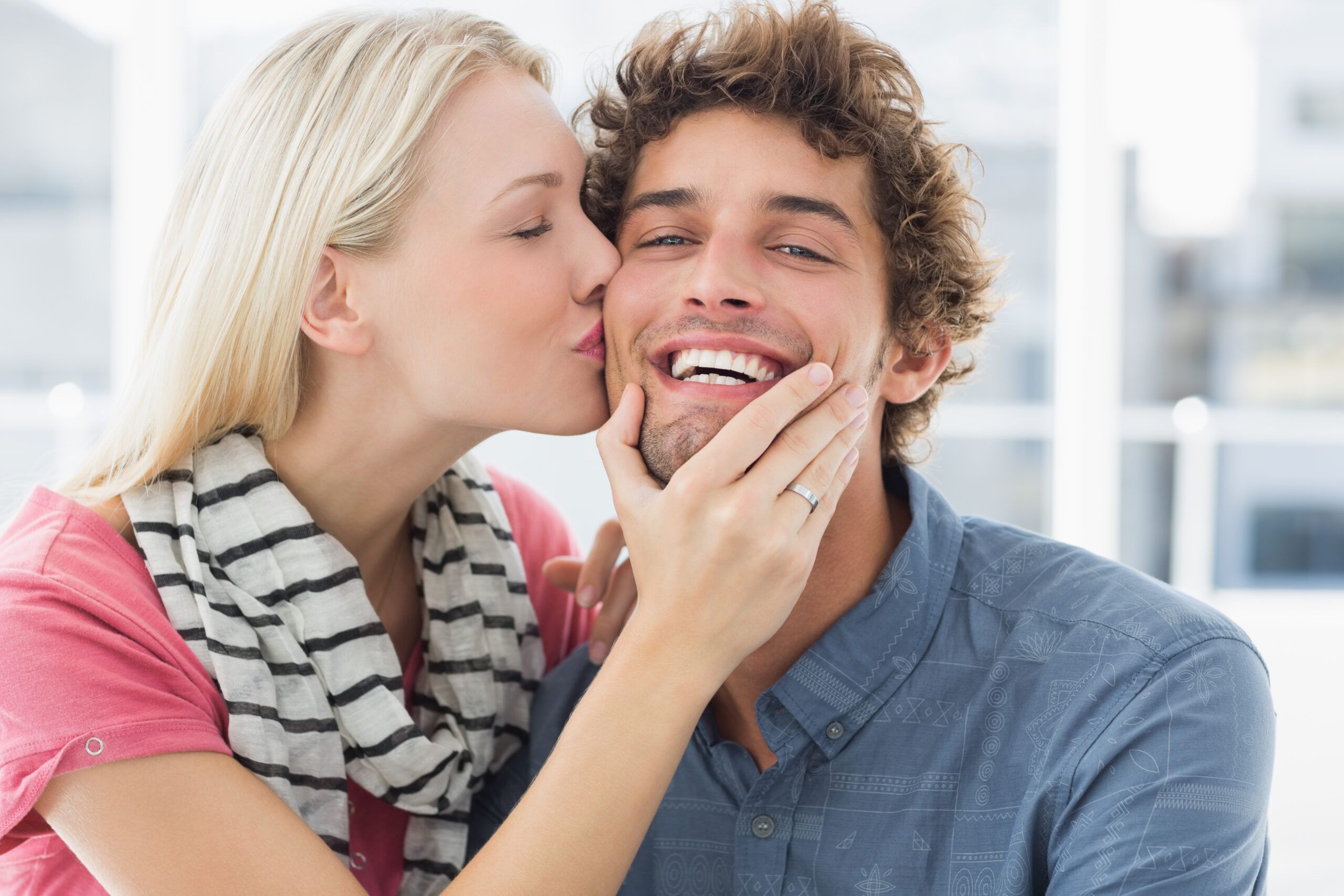 happy wife kissing husband
